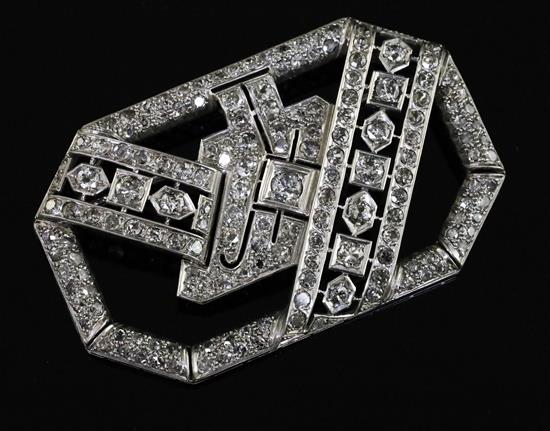 A 1950s/1960s Art Deco style platinum? and diamond set openwork brooch, 57mm.